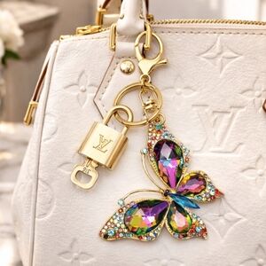 Authentic Louis Vuitton Lock & Key with unbranded Butterfly Bagcharm
